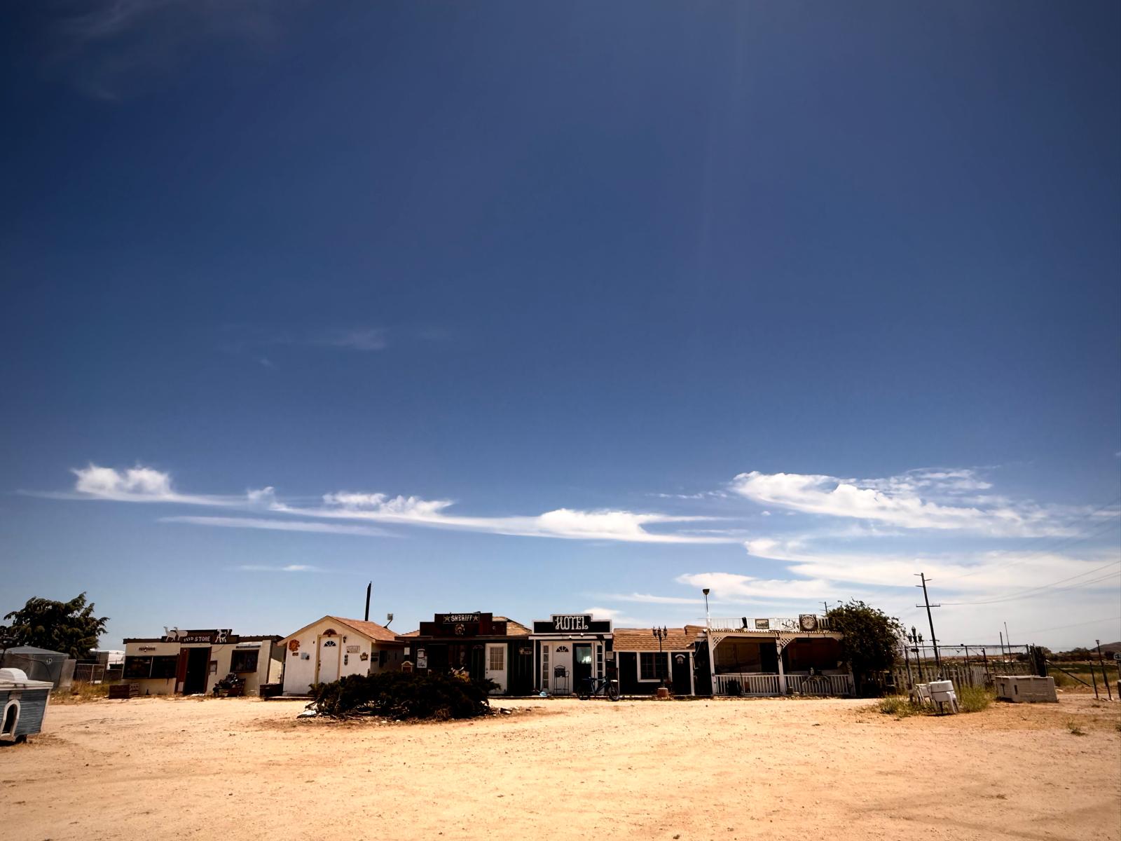 The Hikertown strip: store, sheriff, hotel, and cafe in a row