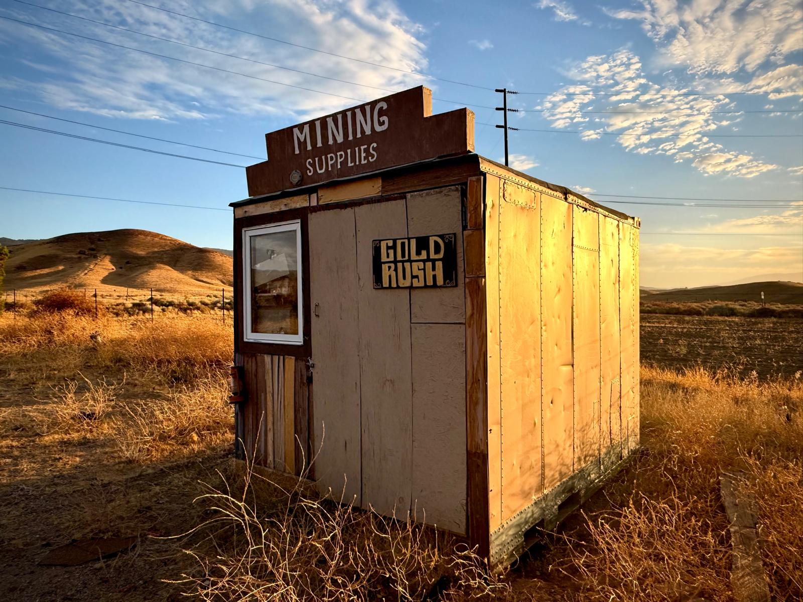 The Mining Supplies shack with a Gold Rush sign nailed to the door